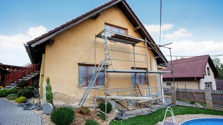 House under renovation with scaffolding