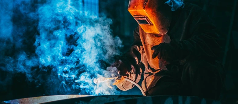 Welder working on metal