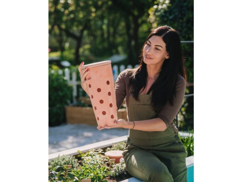 Woman holding compost bin
