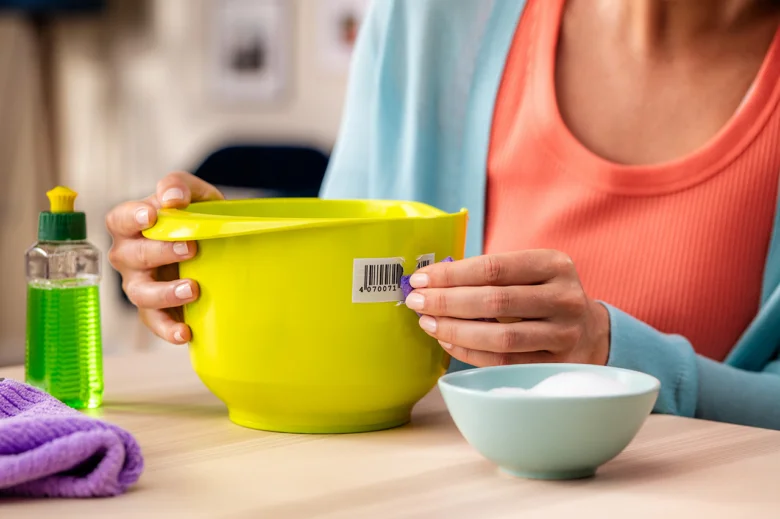 Person peeling sticker off bowl