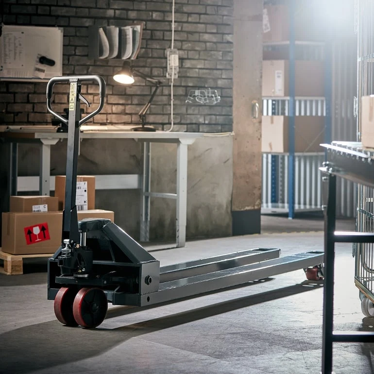 Manual pallet truck in warehouse