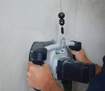 Plaster grinding tool in use