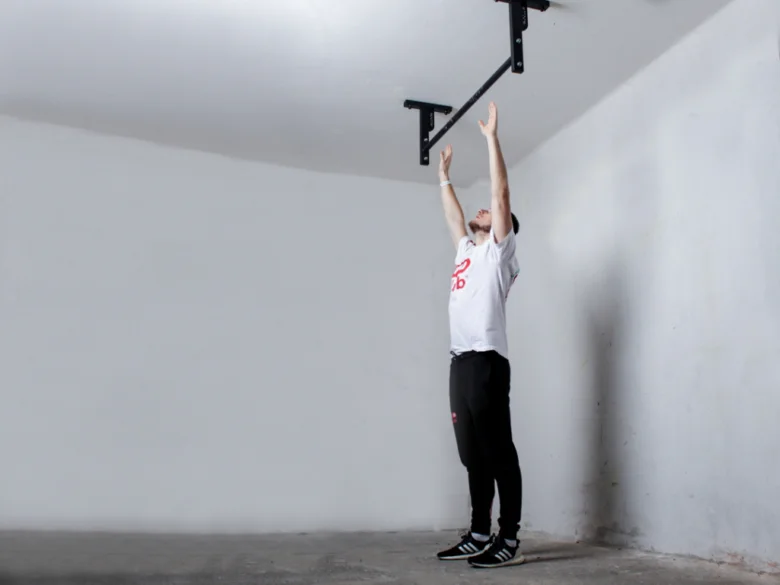 Man hanging on bar