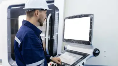 Worker operating cnc machine