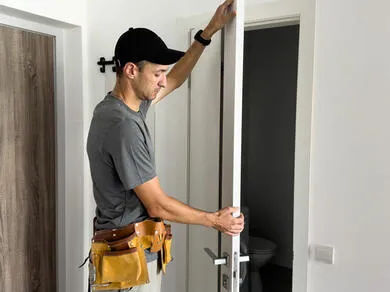 Man installing door frame