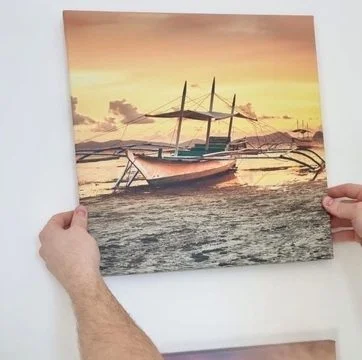 Hands holding a photo print